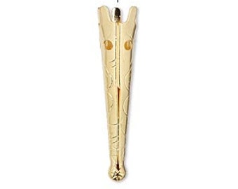 May include: Gold-toned metal pendant with a pointed, textured design. The pendant has two small holes at the top.