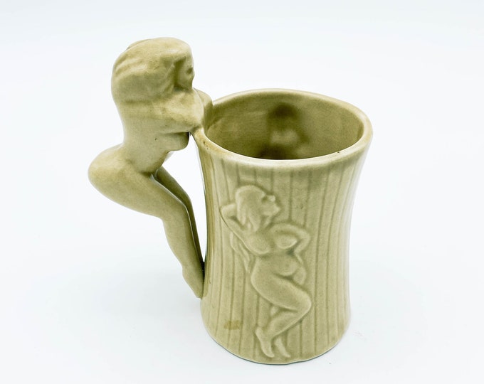 Hubba Hubba Mug with Topless Woman Handle and 2 Naked women in relief on the sides.