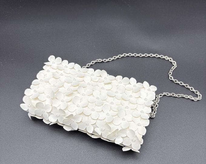 Magnificent Sondra Roberts white Bag with Fabric Flowers with centre bead over all.