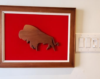 Framed Folk Art Teak or Walnut Buffalo Plaque on Red Velvet, Framed.