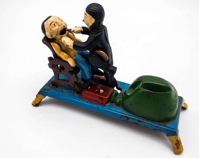 Classic Cast Iron Mechanical Bank. Dentist pulls a tooth