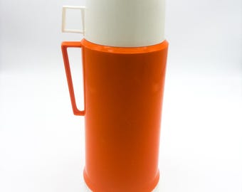 Vintage Mid Century Orange thermos. Thermos brand.