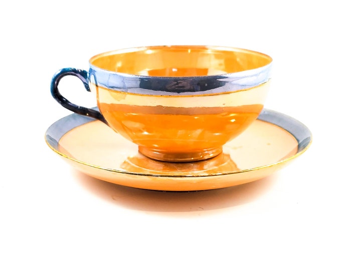 Absolutely Gorgeous Iridescent Peach Lustreware Cup and Saucer Set with Blue detail