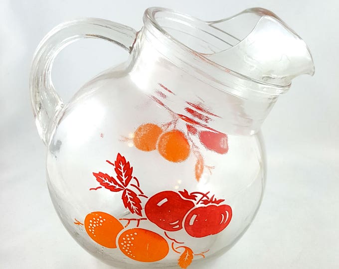 Adorable little Tilted Ball Glass Juice Pitcher