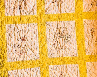 Sweet Embroidered Animal Crib Quilt in Yellow and White with Flagged Edge Trim