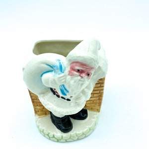 Ceramic Santa Planter on the roof by the chimney