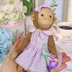monkey in purple dress Monkey in female dress and swing