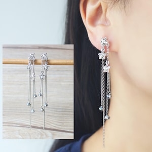 Zilverkleurige Swarovski-kristalsterren onzichtbare harsclip-oorbellen, niet-doorboorde oorbellen, hangoorbellen, cadeau voor haar
