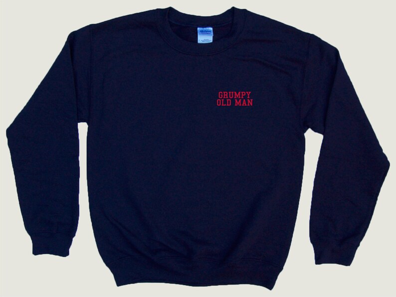 May include: A navy blue sweatshirt with the text "GRUMPY OLD MAN" embroidered in red on the front.