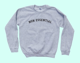 NON ESSENTIAL crewneck - Unisex Adult Sweatshirt - Apparel - Simple Vintage Style - Fast Favorite