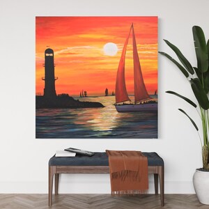 May include: A painting of a sailboat with a red sail sailing away from a lighthouse at sunset. The sky is orange and yellow, and the water is blue and green.