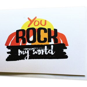 Tarjeta de felicitación inspiradora "You Rock My World"