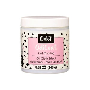 May include: A white jar with a pink label that says "Odif OdiCoat Gel Coating Oil Cloth Effect Waterproof - Stain Resistant 8.68 OZ (246 g)"