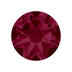 May include: A single, round, dark red rhinestone with a faceted design.