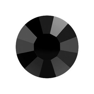 May include: A single black rhinestone with a faceted design.