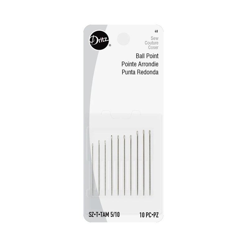 May include: A package of 10 Dritz ball point sewing needles, size 5/10. The needles are silver and come in a clear plastic package with a white label. The label says "Sew Couture Coser Ball Point Pointe Arrondie Punta Redonda SZ-T-TAM 5/10 10 PC-PZ".