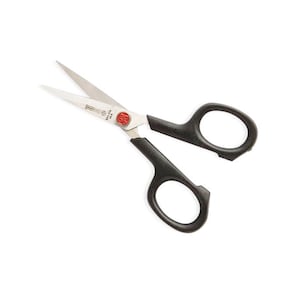 May include: Black handled scissors with a red button on the handle. The blades are made of stainless steel.
