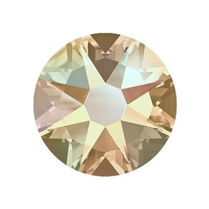 May include: A single, round, iridescent light brown rhinestone with a star-shaped facet pattern.