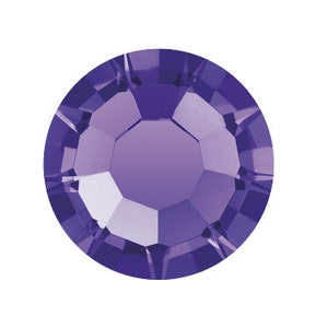 May include: A close-up of a round, faceted, amethyst-colored crystal. The crystal has a flat back and a multi-faceted top, reflecting light. The color transitions from a deep purple at the edges to a lighter shade in the center. This decorative crystal is suitable for various craft projects.