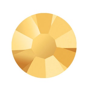 May include: A single, round, gold-colored rhinestone with a faceted design.