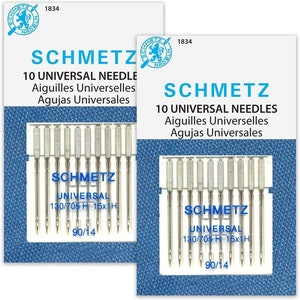 May include: Two packages of Schmetz universal sewing machine needles. Each package contains 10 needles and features the Schmetz logo, product information, and the text "10 Universal Needles" in English, French, and Spanish. The needle size is 90/14.