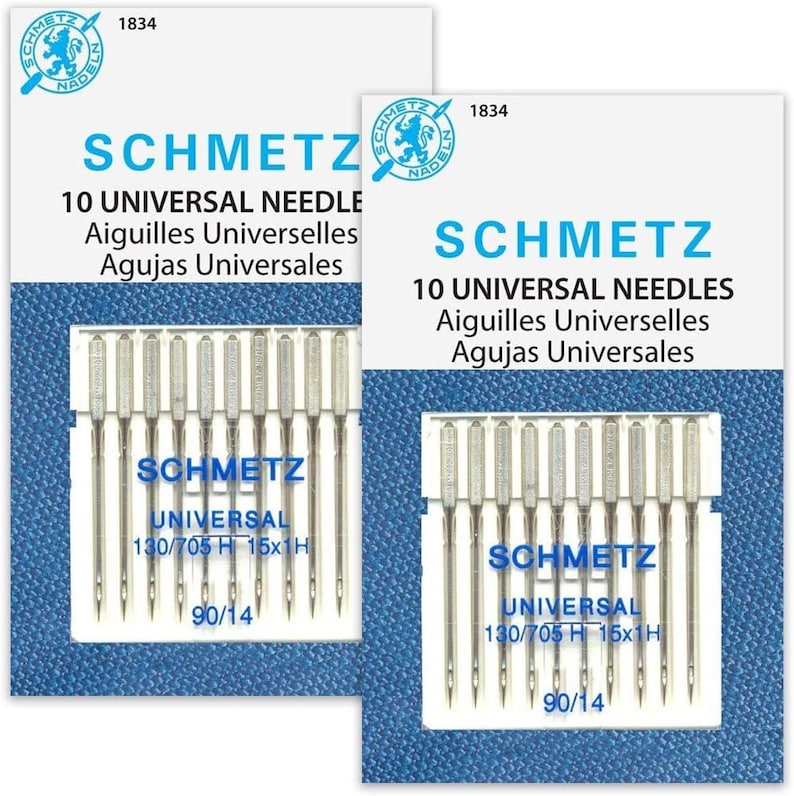 May include: Two packages of Schmetz universal sewing machine needles. Each package contains 10 needles and features the Schmetz logo, product information, and the text "10 Universal Needles" in English, French, and Spanish. The needle size is 90/14.