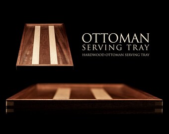 May include: A wooden serving tray with a light wood inlay. The tray is made of hardwood and has a rectangular shape. The text "OTTOMAN SERVING TRAY" and "HARDWOOD OTTOMAN SERVING TRAY" is printed on a black background.