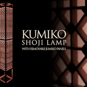 May include: A tall, wooden floor lamp with a geometric, lattice-like design. The lamp is lit and casts a warm glow. The text "KUMIKO SHOJI LAMP WITH REMOVABLE JUMIKO PANELS" is visible in the image.