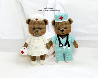 May include: Two crocheted teddy bears dressed as medical professionals. One bear is wearing a white nurse's uniform with a red cross on the hat and a small red cross bag. The other bear is wearing a blue doctor's uniform with a stethoscope and a red cross on the hat.
