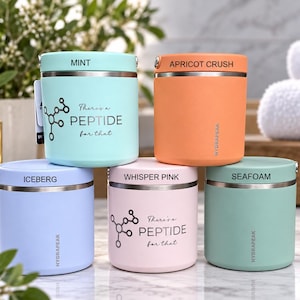 May include: Five cylindrical insulated food containers in mint, apricot crush, iceberg, whisper pink, and seafoam colors. Each features a metallic rim, a lid, and the brand name HYDRAPEAK. Two containers display a molecular graphic and the text There's a PEPTIDE for that.