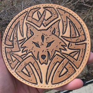 May include: A set of three ceramic mugs with a speckled, matte finish in cream, light grey, and dark grey. Each mug has a simple, minimalist design and a rounded handle.