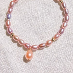 AAA rainbow purple pearl stretch bracelet with peach pearl charm 14K Gold Fill, wrist size 6 inches, June birthstone, elastic bracelet