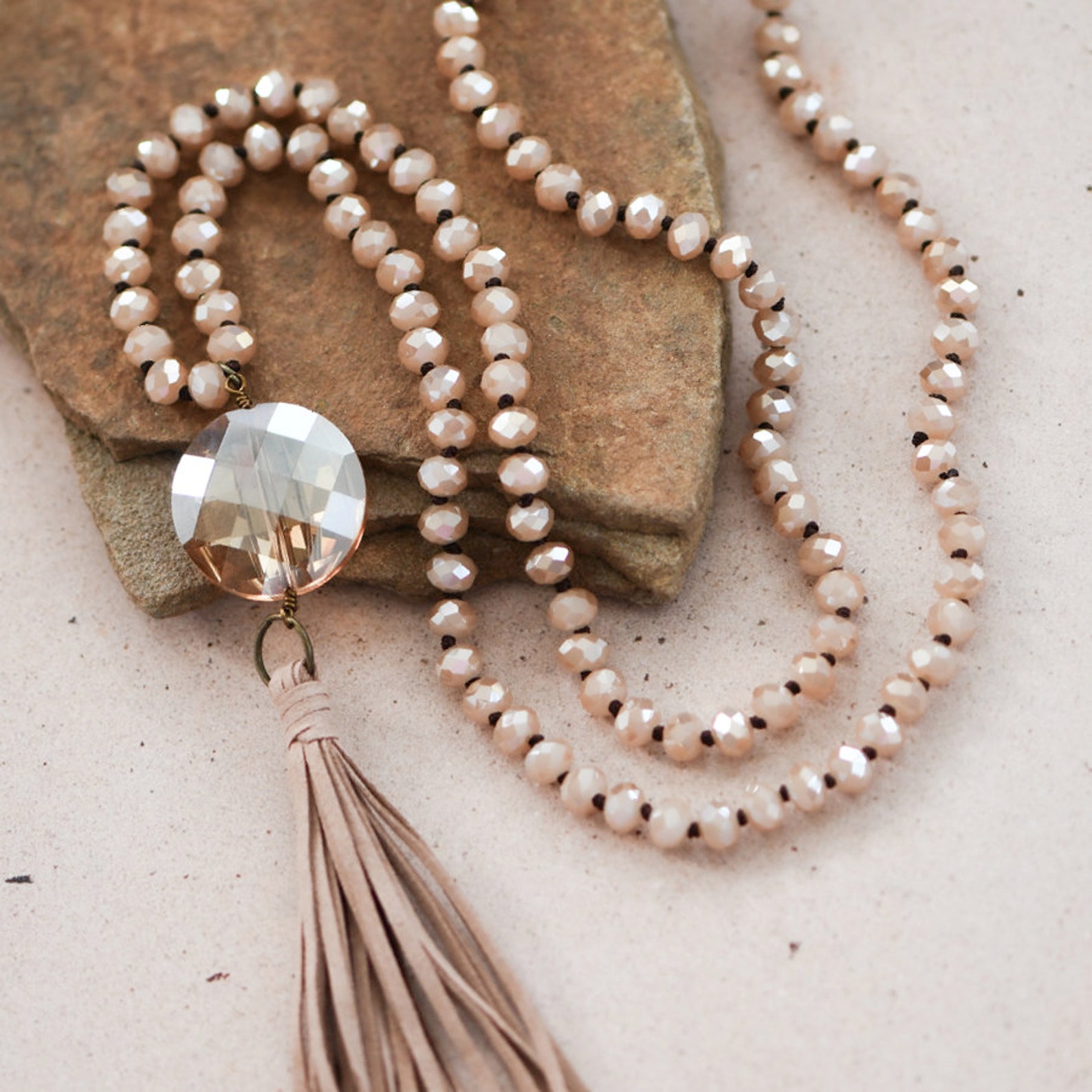 Beautiful Leather Tassel Glass Crystal Pendant Necklace to complete the look.