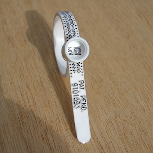 May include: White plastic cable tie with a numbered ring and the text "PAT. PEND. 9101693".