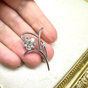 Silver Tone Flower Brooch With Rhinestones