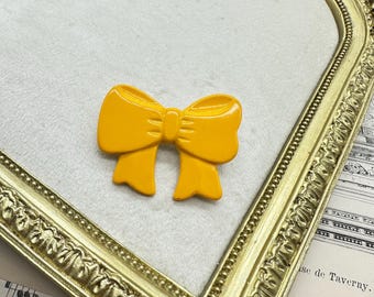 Broche con lazo de cinta amarilla de joyería vintage