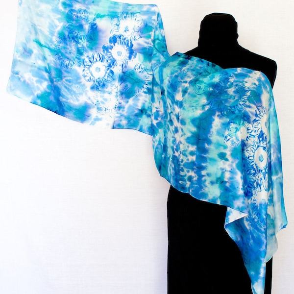 Hand-painted pure silk blue scarf. Drawing of a flower in the center. Created for those who love nature and flowers.