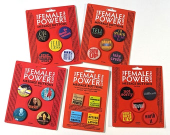 Button packs, 5 sets, and a set of five: feminist messages on multiple pin-back buttons on information card