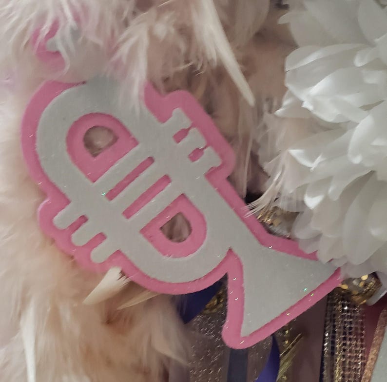 May include: A white and pink trumpet-shaped party decoration with glitter.