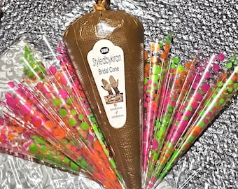 May include: A brown henna cone with the text "Styledbykiran Bridal Cone" and a small image of hands. The cone is surrounded by clear plastic cones with pink, green, and orange polka dots.