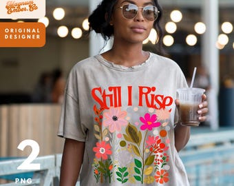 May include: A gray t-shirt with a floral design and the text "Still I Rise" in red. The text "Maya Angelou" is printed below the floral design.