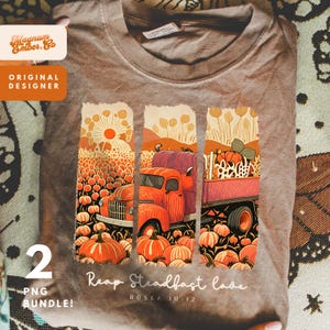 May include: A folded brown t-shirt with a fall-themed design. The graphic shows an orange truck filled with pumpkins, set against a pumpkin field and a sunset. The shirt includes the text "Reap Steadfast Love" and "HOSEA 10:12".