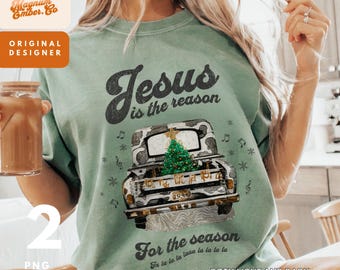 May include: A green t-shirt with a vintage-style design featuring a truck with a Christmas tree in the back. The text on the shirt reads "Jesus is the reason for the season" with musical notes and "fa la la la la la la la" underneath.