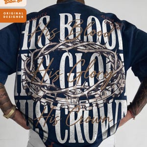 May include: A white ceramic mug with a black handle and the text "But First, Coffee" in a bold, black font. The mug is set against a blurred background, highlighting its clean design.