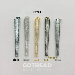 May include: Five pendant charms in different finishes: black, silver, gold, antique gold, and silver. Each charm is a long, pointed, cylindrical shape with a clear crystal-like design. The charms are labeled with their finishes below. The text "GOTBEAD BEAD FOR YOU" is at the bottom of the image.