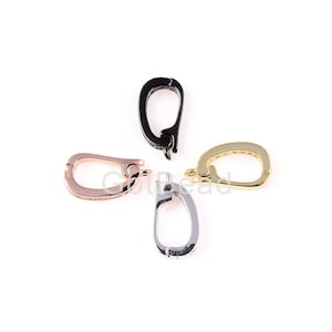 Puede incluir: Cuatro cierres metálicos de diferentes colores para la elaboración de joyas. Los cierres son de forma ovalada y tienen un cierre de resorte. Los colores son negro, oro, oro rosa y plata.