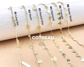 May include: Ten gold chains with different pendant shapes, including long bars, hearts, round discs, diamonds, triangles, and spear heads. The chains are displayed on a white background with the text "GOTBEAD BEAD FOR YOU".