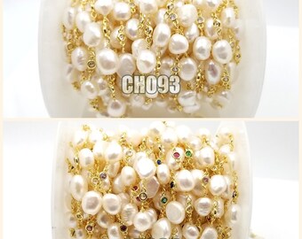 May include: A close-up of two spools of white pearl and gold chain with colorful gemstones. The spools are labeled "CH093" and "CH094".
