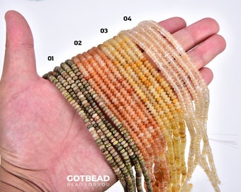 May include: A hand holding strands of various colored gemstone beads. The beads are small and round, and they are arranged in a rainbow pattern. The beads are labeled with numbers 01 through 04. The text "GOTBEAD BEAD FOR YOU" is visible at the bottom of the image.