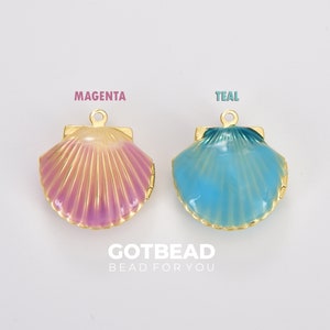 May include: Two gold-tone seashell charms with a hinged opening. The charm on the left is magenta and the charm on the right is teal.